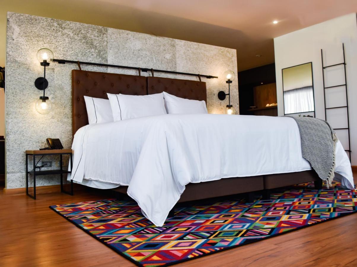 Hotel V1501 Pasto Ngoại thất bức ảnh A bedroom with a carpet