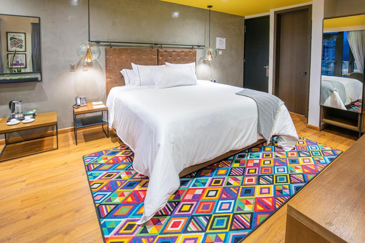 Hotel V1501 Pasto Ngoại thất bức ảnh A carpet in a bedroom